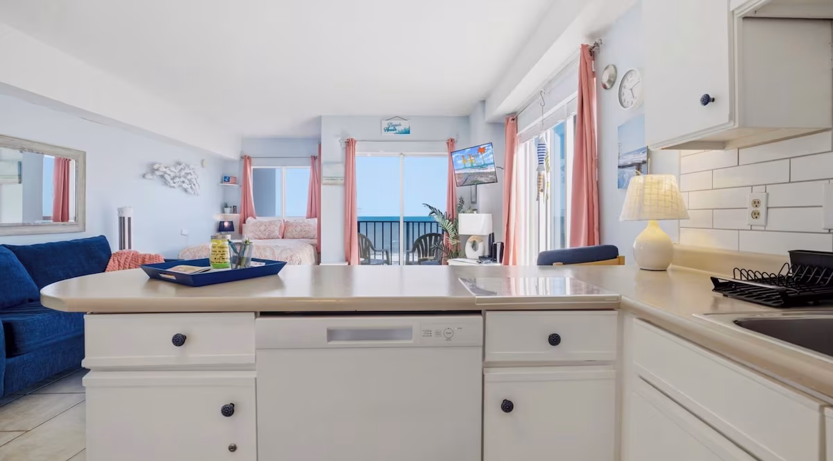 Kitchen breakfast bar looking through the beachfront studio to the ocean